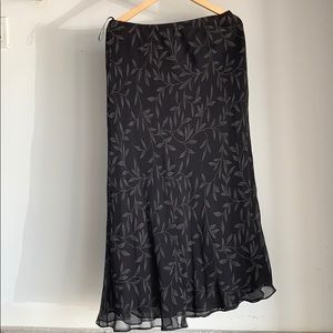 Long black skirt with a gray floral design